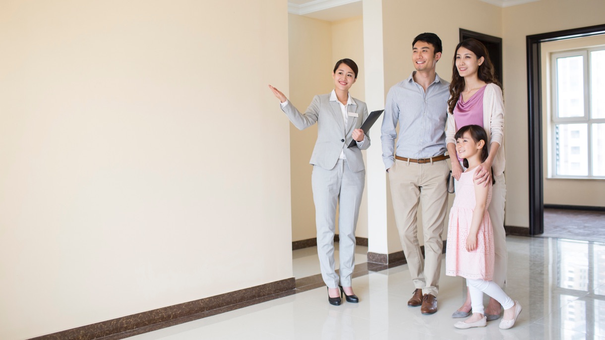 Estate agent showing a flat to a family